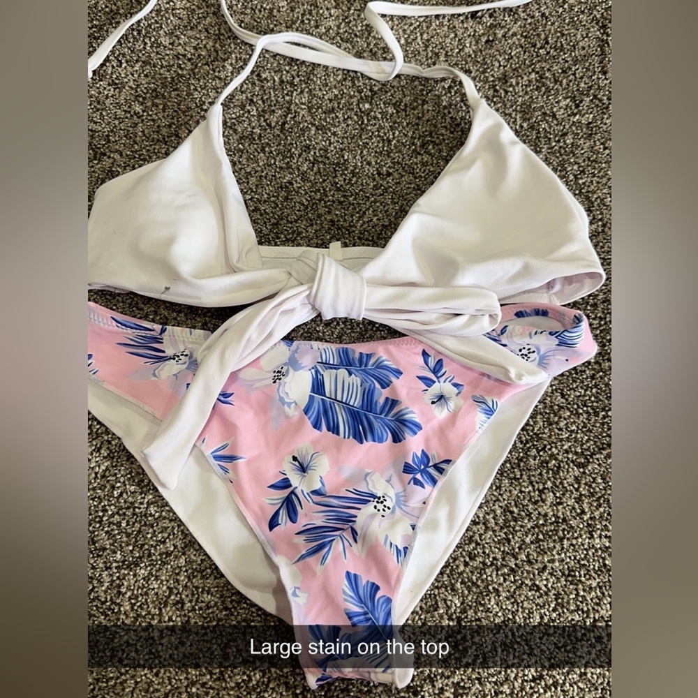 Swim suit from Amazon bottoms never worn top has a small stain on it